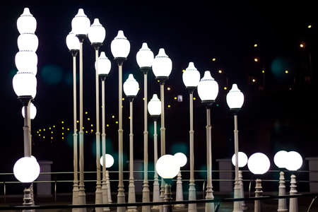 A lot of white street lamps