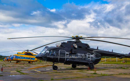Vintage aircraft preparing for take-off on the background of a stormy skyの写真素材