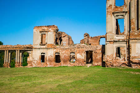 The ruins of a medieval castle in Ruzhany. View of the ruined old palace complex with columns. Brest region, Belarus.の写真素材