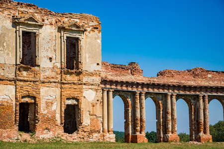 The ruins of a medieval castle in Ruzhany. View of the ruined old palace complex with columns. Brest region, Belarus.の写真素材