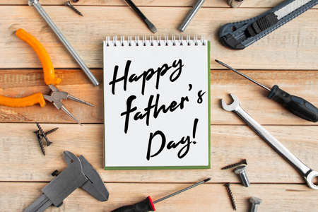 Set of work tools on a wooden background. Festive greeting card concept for Father's dayの写真素材