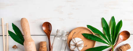 Eco-friendly recyclable products on white wooden background. Plastic-free kitchen accessories....