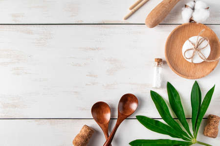 Eco-friendly recyclable products on white wooden background. Plastic-free kitchen accessories. Place...
