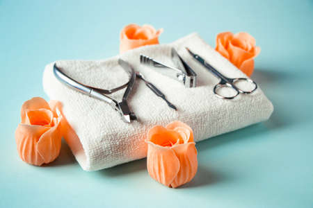 Nail care tools on a blue background. Spa accessories for body care.の写真素材
