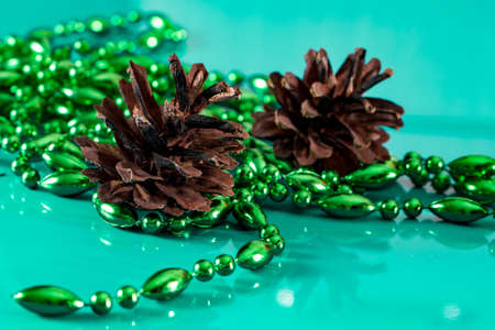 Christmas composition with place for text. Fir branches, cones and sweets on a blue background.の写真素材