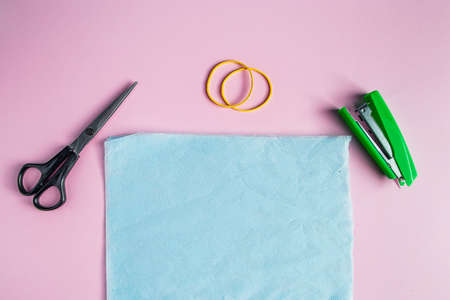 Handmade blue medical mask. Do-it-yourself protection against coronavirus. Tools for creating a respirator at home. Step 1.の写真素材