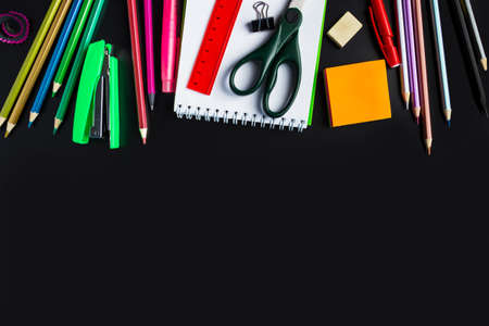 Set of stationery on a black background. Back to school concept. Place for text.