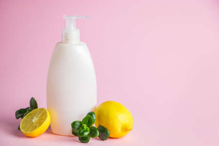 Natural cosmetics for skin care with lemon. Organic beauty product with citrus on a pink background. Place for text.の写真素材