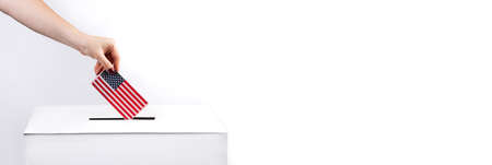 Woman puts the USA flag into voting box. Election concept, place for text. Banner format