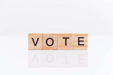 Voting concept. The word "vote" on a white background.の写真素材