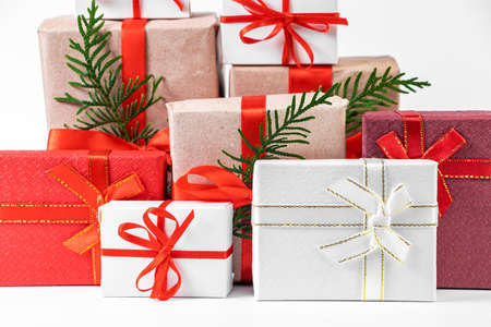 Stack of beautiful gift boxes on a white background. Festive New Year concept.