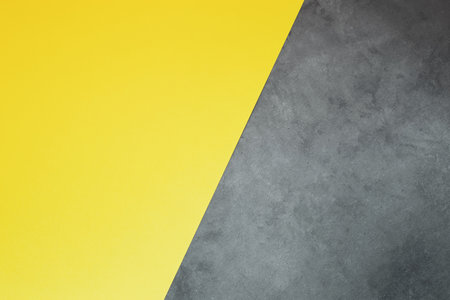 Yellow-gray background. Minimalistic geometric concept for design. Trend color of 2021 is illuminating and ultimate gray.の写真素材