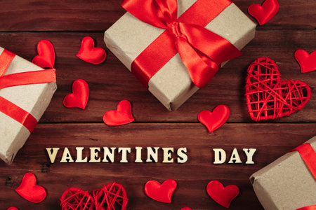 Valentine's day concept. Gifts in craft paper with red ribbons.
