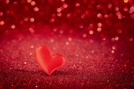 Cute red heart for valentine's day on bokeh background. Greeting card, place for text.の写真素材