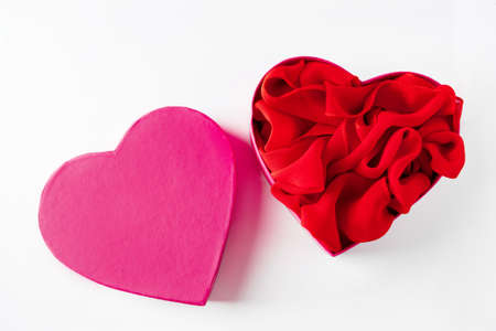 Open pink heart shaped gift box on  white background. Design for Valentine's Dayの写真素材