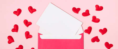 Envelope with greeting card for valentine's day. Romantic holiday concept. Hearts on pink...