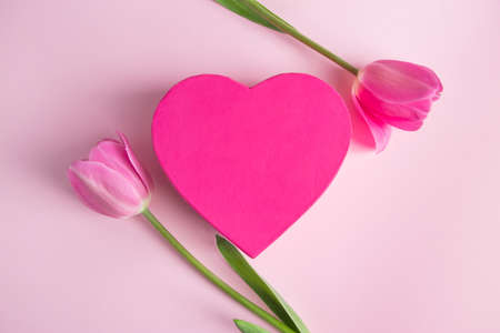 Valentines day concept. Pink heart and tulips. Greeting card, place for text.の写真素材