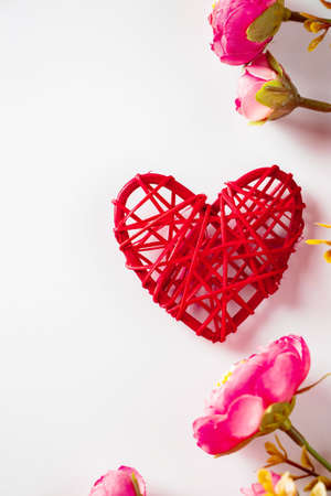 Flowers and red hearts on  white background for Valentine's Day.の写真素材