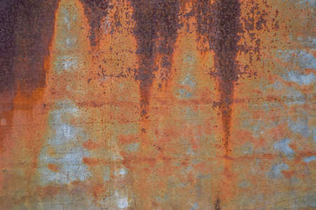 Background from rusty metal close-up. Rust spots on the iron.