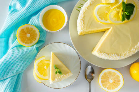 Lemon biscuit dessert decorated coconut flakes. Delicate cake with white cream cheese.の写真素材