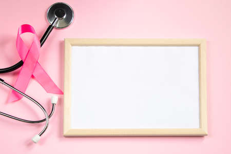 Breast Cancer Awareness Month. Pink ribbon fight symbol. Empty frame mocap for text. Womens health care conceptの写真素材