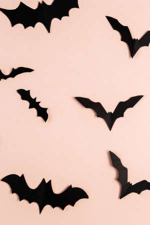 Halloween concept. Bats and spiders on a pink background. Festive decorations.の写真素材