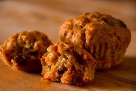 Homemade raisin cupcakes. Traditional autumn pastries on a wooden background.の写真素材