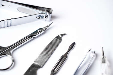 Tools for manicure and nail care on a white background.