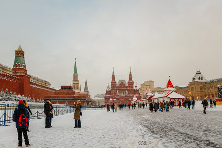 Tourists on Red Square in Moscow in winter. Travel to Russia in December and January. Landmark Kremlin. January 10, 2015 - Moscow, Russia.のeditorial素材