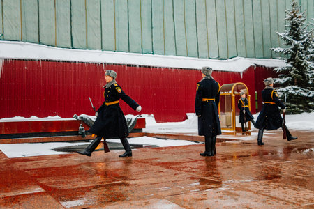 Changing of guard of honor at Moscow Kremlin in winter. Soldiers in military uniform. The famous place is Eternal Flame in memory of those killed in World War II. January 10, 2015 - Moscow, Russia.のeditorial素材