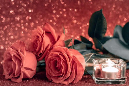 Valentines day romantic card. Bouquet of roses and candle on pink background.