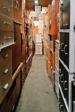 Warehouse of office furniture. Unusual corridor of bedside tables. Sale of used cabinets. Furniture...