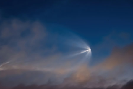 Soyuz space rocket launch. Space jellyfish in sky. Plume of rocket gases in sun at dawn. Jet trail from space rocket. Astronomical phenomenon over city.の写真素材