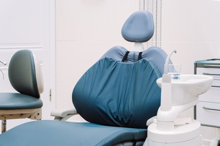 Modern dentistry clinic. Dental chair and tools for treatment and surgery of teeth. Dentist medical equipment. Empty dental office waiting for patient.の写真素材