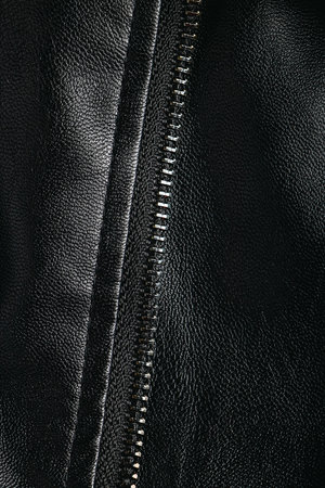 Texture of natural leather close up. Background of black leather clothes. Design elements.の写真素材