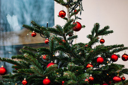 Christmas street decor. Festive trees with Christmas red balls. City decorations for New Year.の写真素材