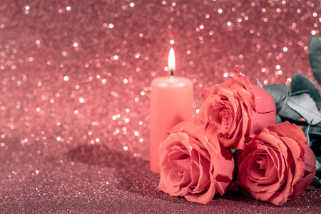 Valentine's day romantic card. Bouquet of roses and candle on pink background.の写真素材