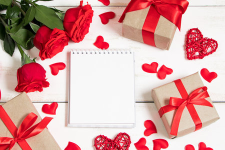 Valentine's day greeting card. Red roses and hearts on white background. Place for text.の写真素材