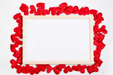 Valentine's day greeting card. Frame from red hearts on white background. Layout with place for text.の写真素材