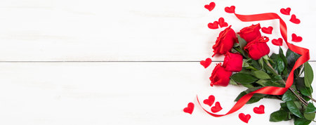 Valentine's day concept. Red roses, hearts and gift boxes on white background. Mockup, place for text.の写真素材