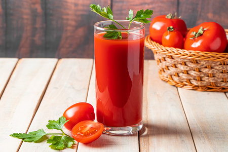 Diet tomato juice with parsley on a wooden background. Vegan vegetable smoothie.の写真素材