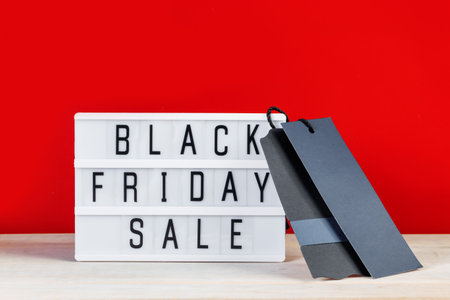 Black Friday sale concept. Label and lightbox on red background.の写真素材