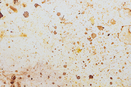 Texture of dirty stains and grease on white stove. Spots of fat on a white backgroundの写真素材