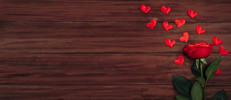 Red rose and hearts on wooden background. Valentine's day concept, greeting card.の写真素材