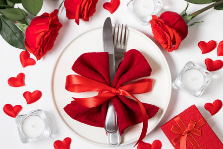 Candlelit dinner for two lovers. Beautiful table setting for valentine's day.の写真素材