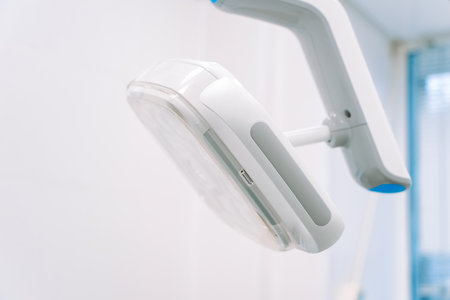 Surgical lamp for dental treatment and surgery. Modern dental equipment in dentist clinic. Led lamp used by dentists.の写真素材