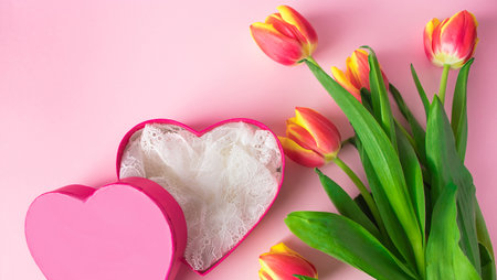 Tulips and pink heart. Valentines day greeting card. Place for text.の写真素材