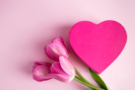 Tulips and pink heart. Valentines day greeting card. Place for text.の写真素材