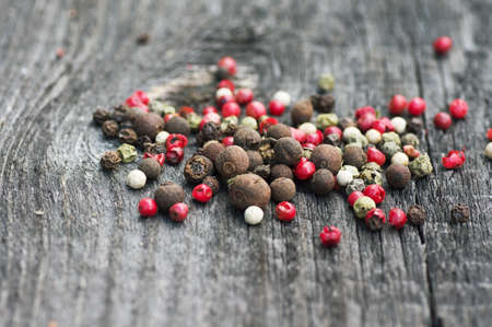 Colored mixture bell peppers on a wooden boardの写真素材