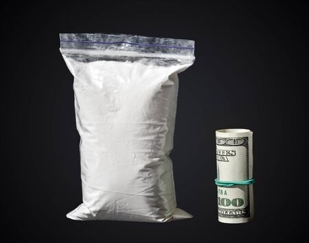 drugs, cocaine with money isolated on a black backgroundの写真素材